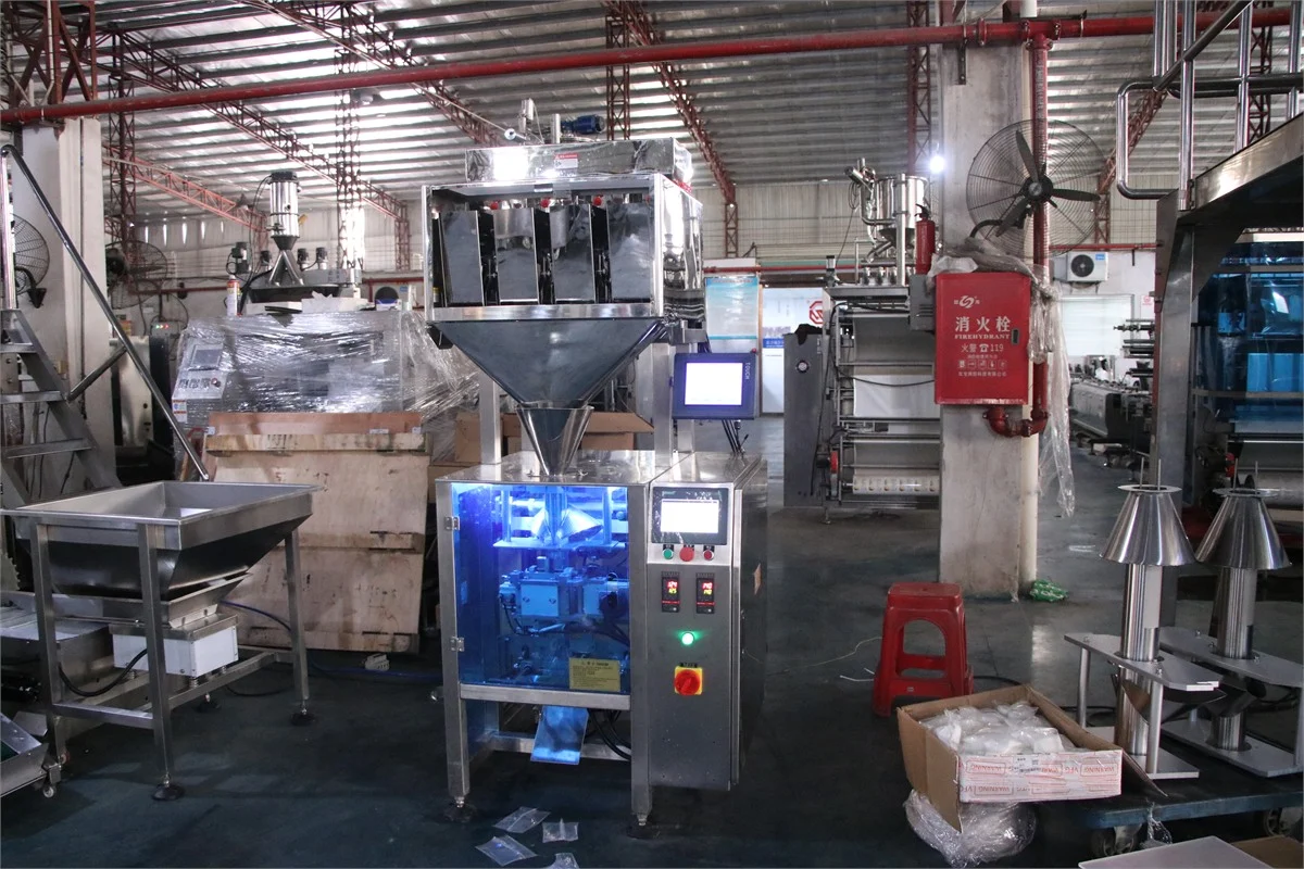 SW-320C collar type 4-head linear weigher packing machine — full front view with integrated weigher, forming collar, and output tray