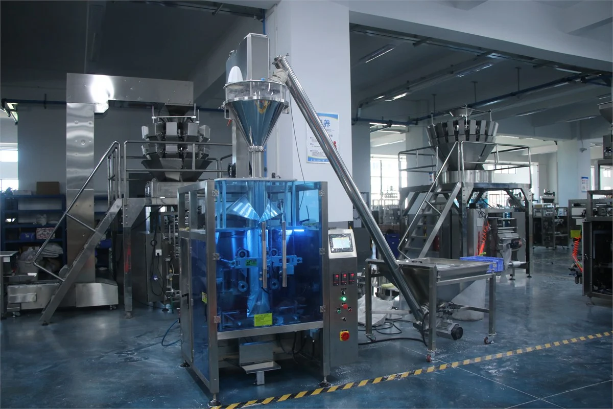 SW-420E collar type auger powder packing machine — full factory floor view with auger screw conveyor