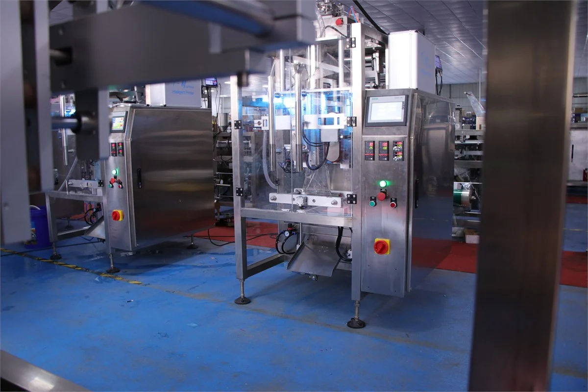 SW-420F collar type liquid packing machine side view showing output side and conveyor connection point