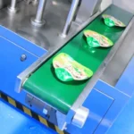 SW-Y200 outfeed conveyor with finished liquid pouches