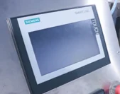 Siemens SMART 700 HMI touch screen on SW-350B film beneath feeding pillow packing machine — 100-recipe memory