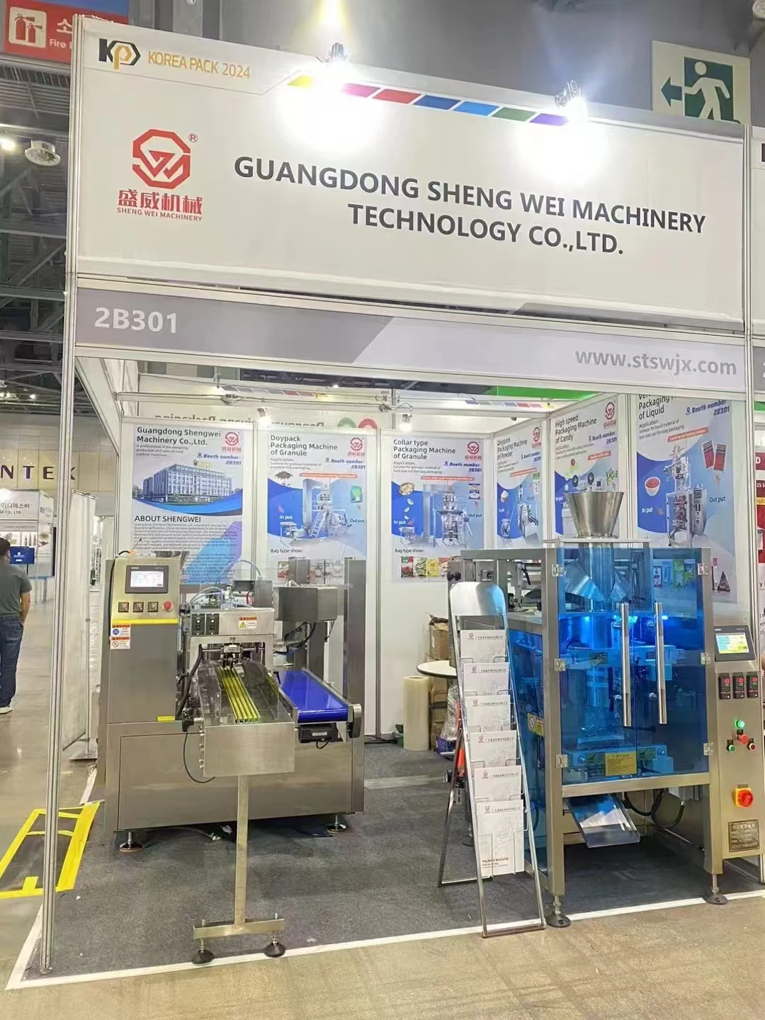ShengWei Machine booth 2B301 at KOREA PACK 2024 — premade bag packing machine and collar type machine on display
