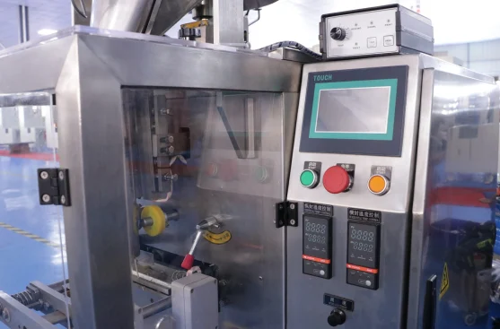 SW-2030A back seal granular packing machine — close-up front view showing turntable cup feeder, forming tube, and seal mechanism