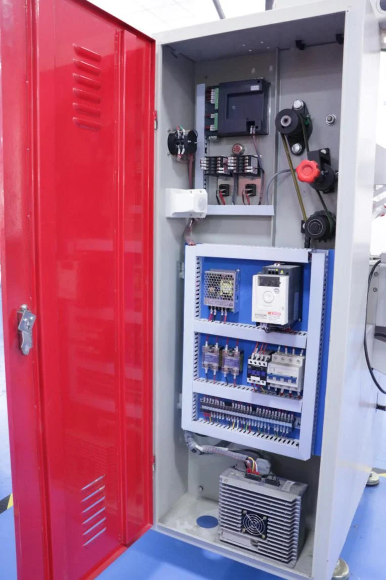 Electrical cabinet open view with inverter, breakers, and internal wiring layout for candy packing machine