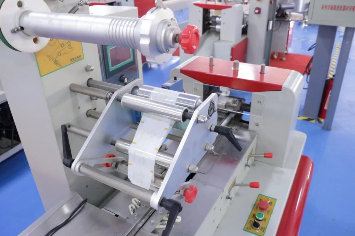 Film feed and forming area shared between SW-1000A and SW-1000B candy pillow packing machines
