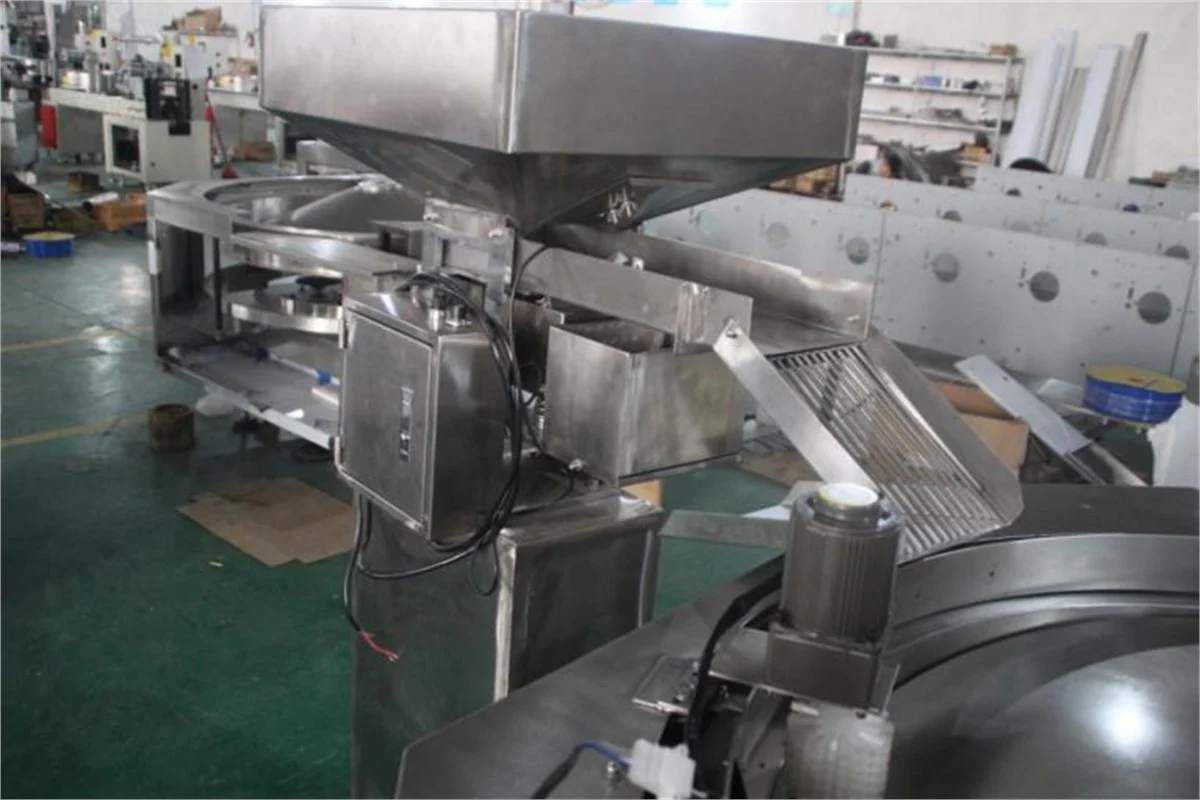 SW-300A 工厂内的振动送料器与转盘连接区域