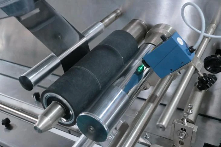 SW-300B blue color mark sensor mounted on the film feed roller for registration mark tracking