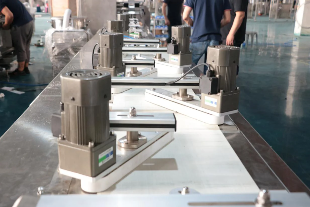 Six Panasonic servo motors mounted in a row on the SW-300B tidying belt conveyor system