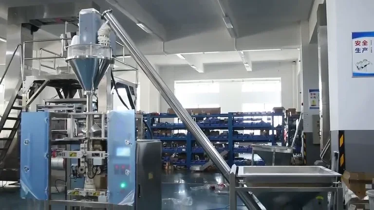 Vertical auger powder packing machine with an inclined auger loader and a feed hopper in a factory workshop